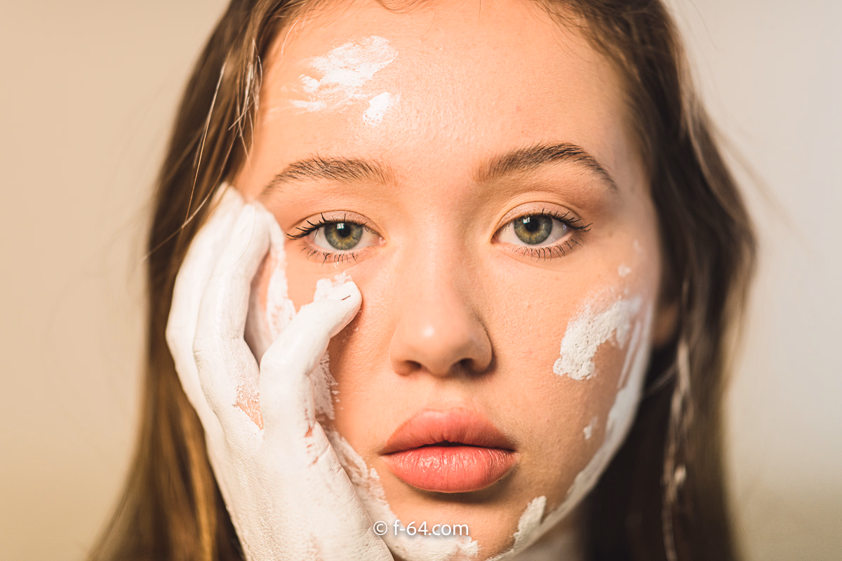 Boudoir photography with colorful body paint and glitter — creative indoor session in Sacramento